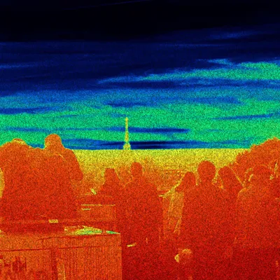 Thermal camera view of a crowd with the Eiffel Tower visible in the distance