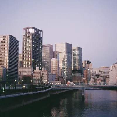 Osaka city skyline at dusk reflected in the Okawa River