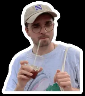 Me with a cap holding an iced coffee cup and winking