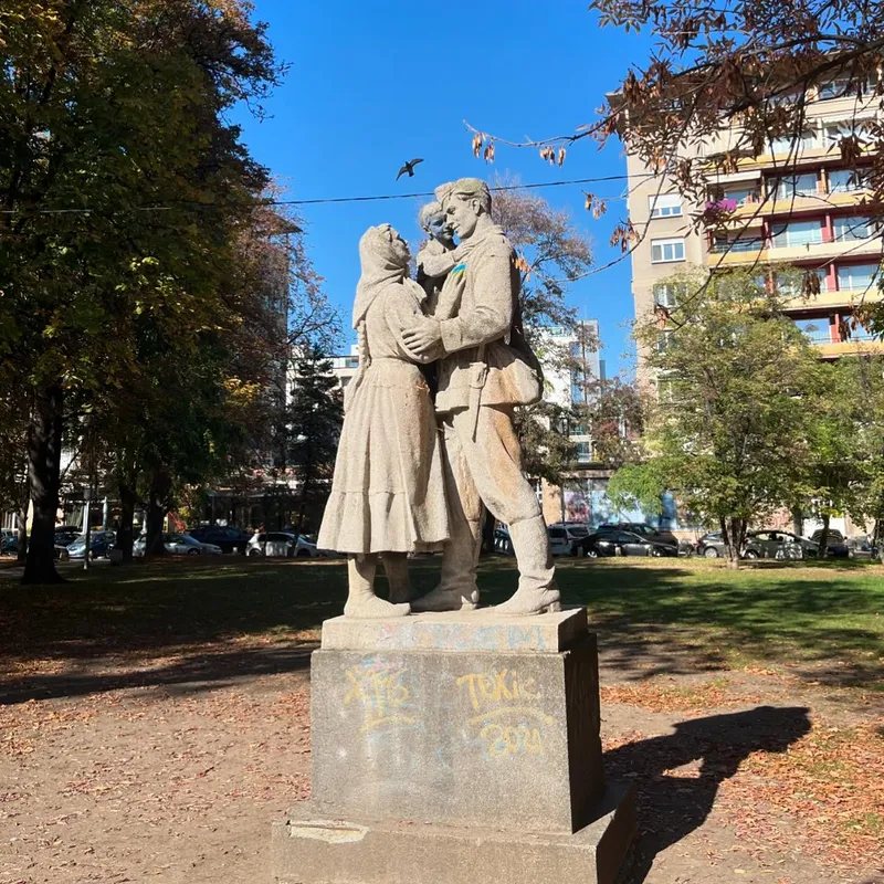 A Soviet-era statue of an embracing couple in a park