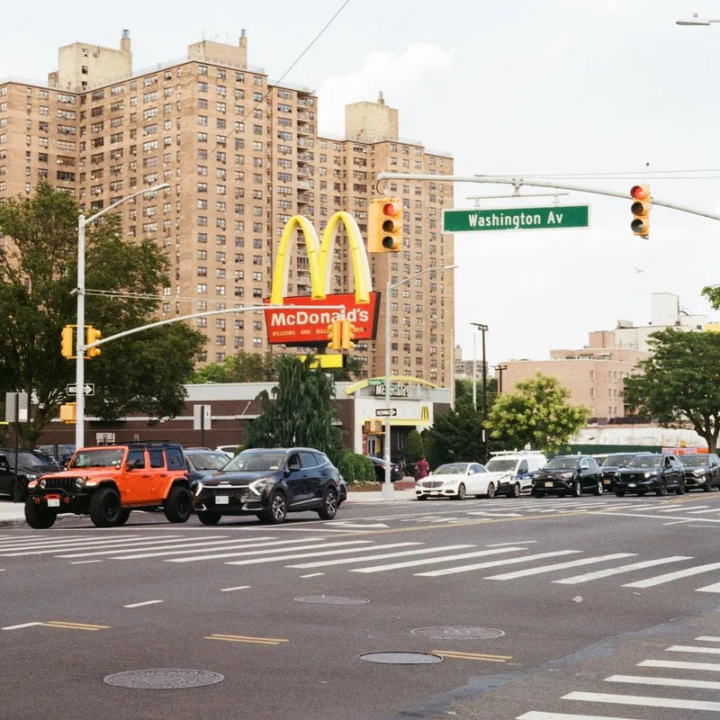 A busy intersection with a McDonald's sign on Washington Avenue