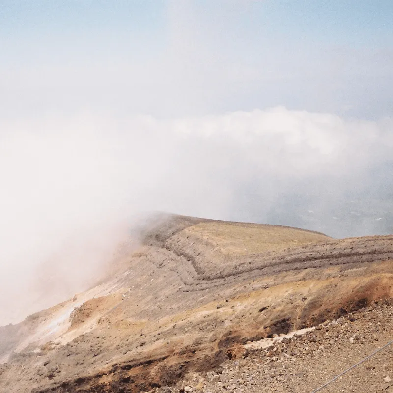 Mountainous ridge disappearing into a cloud in the Daisetsuzan volcanic massif in Hokkaido